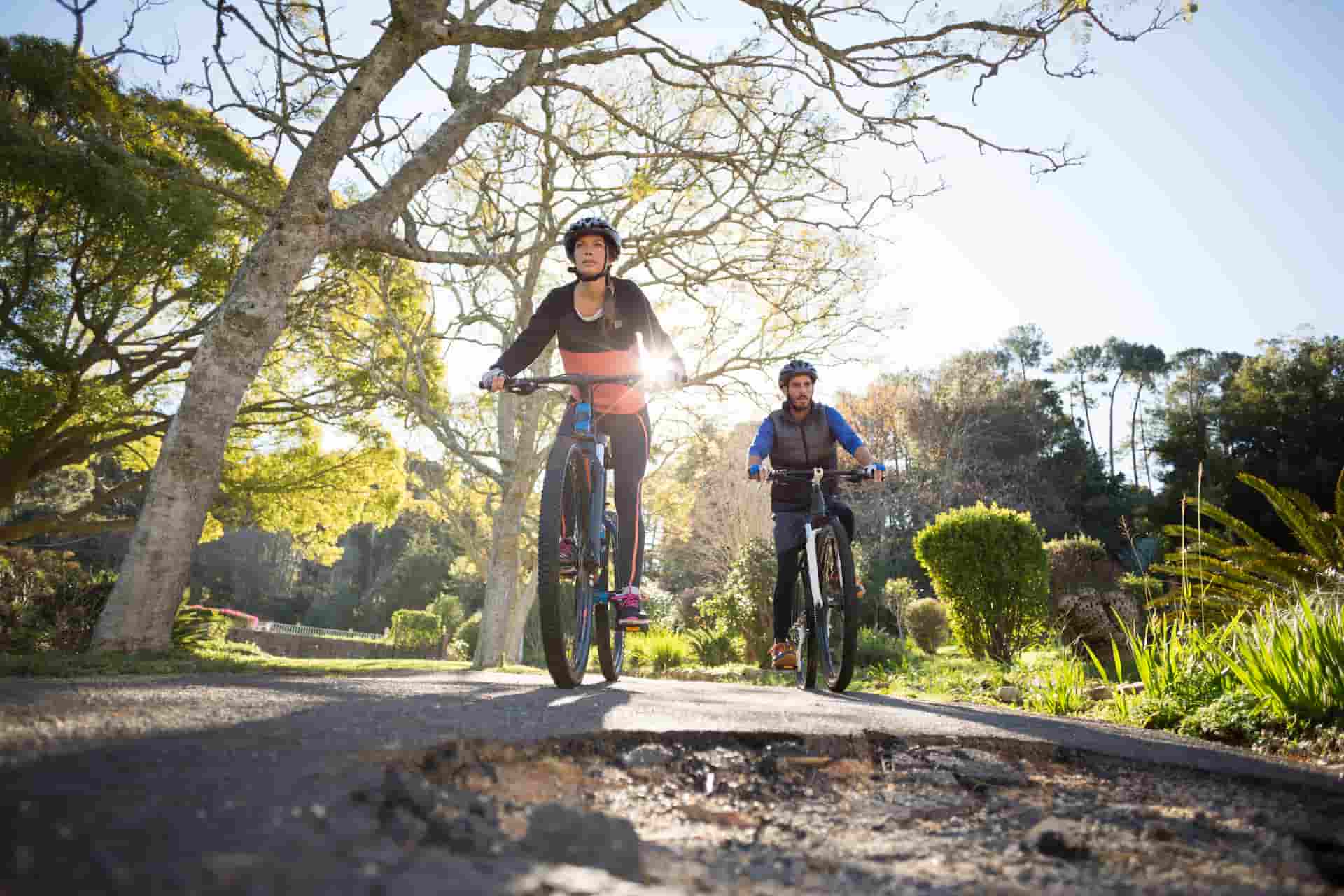 cyclers approach large pothole in the lane cyclers approach large pothole in the lane